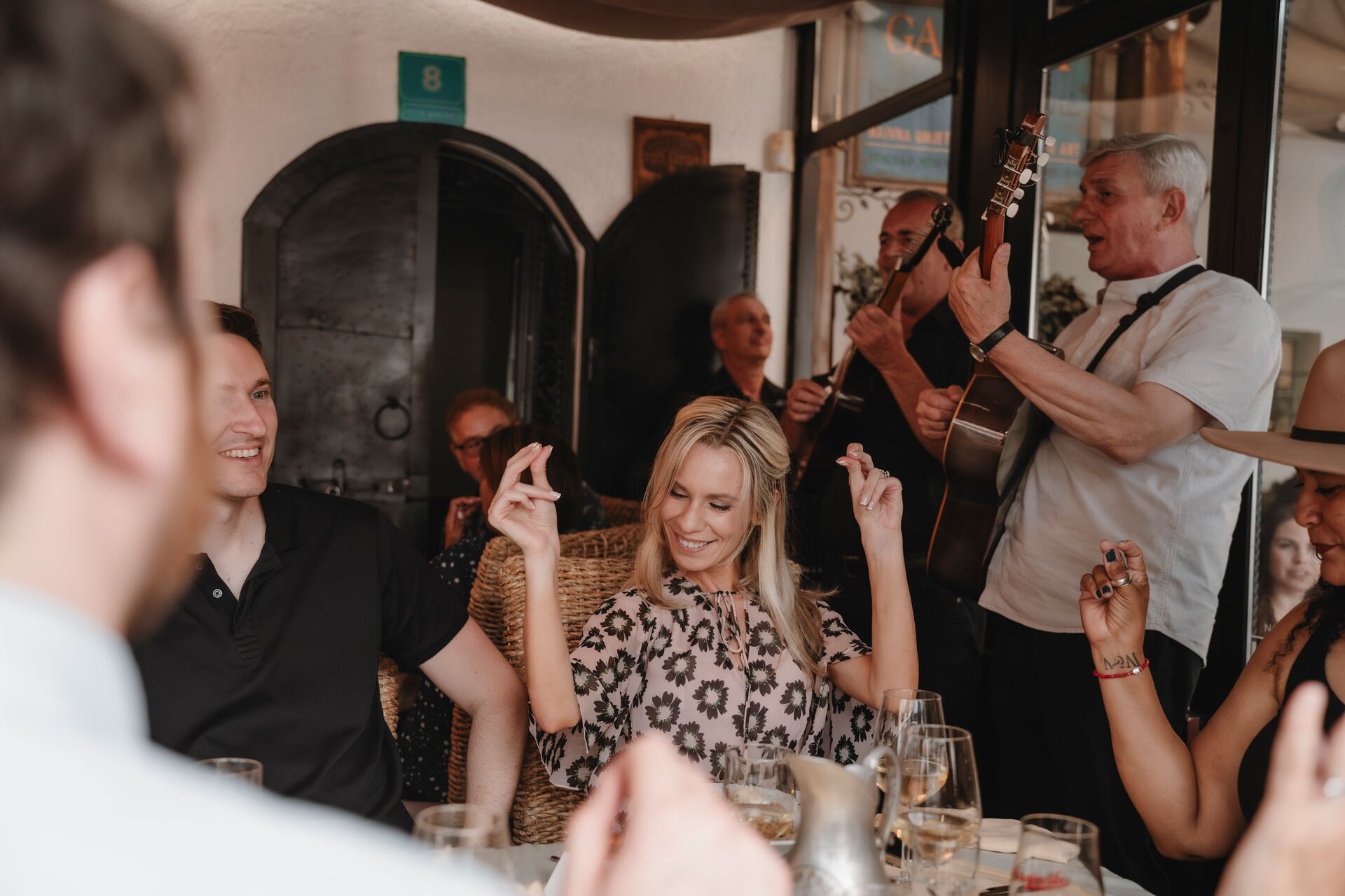 Guests dancing to traditional music while in restaurant in Bosnia 
