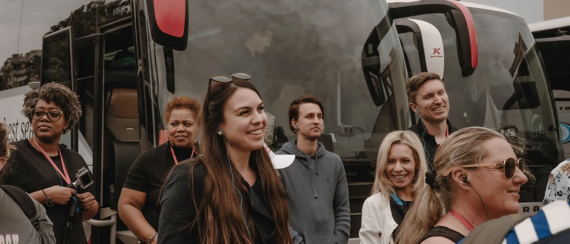 Group of tourists on the background of the coach
