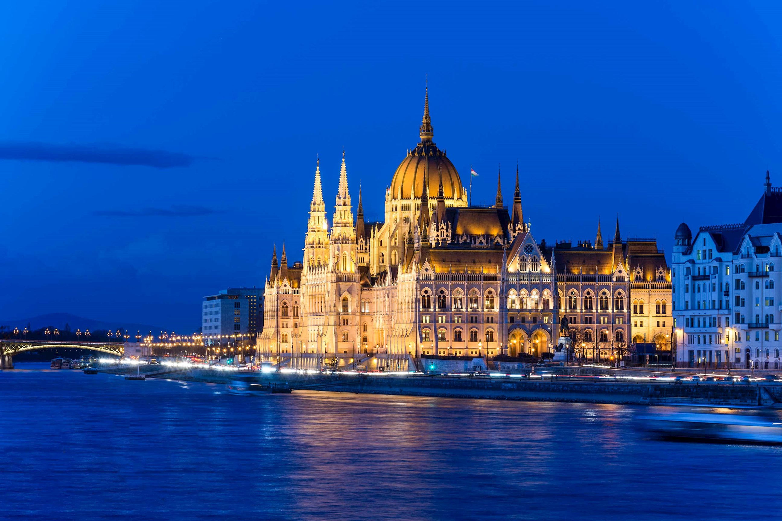 A nighttime view of the Hungarian Parliament Building in Budapest, Hungary