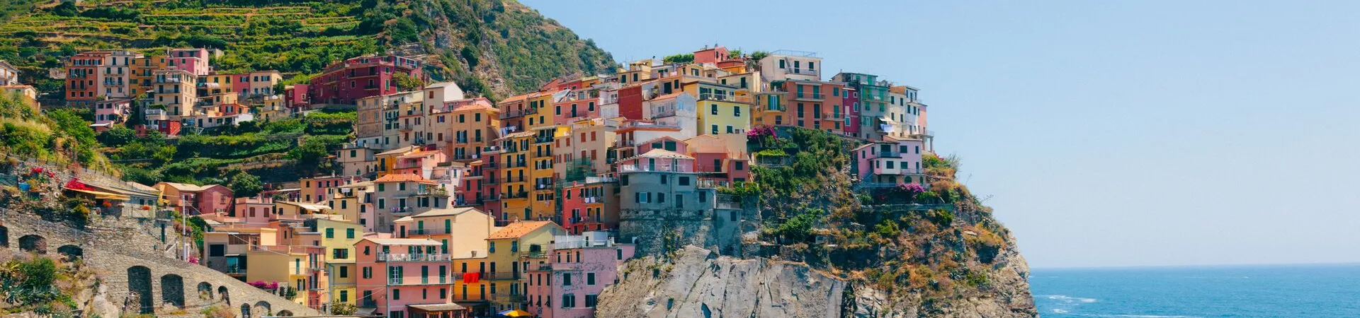 Colourful buildings on a rugged coastline in Italy