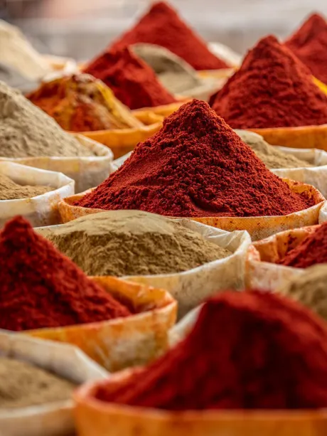 Piles of exotic spices on local street market in Morocco