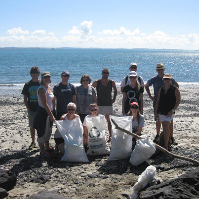 Staff from The Travel Corp NZ doing their bit to assist Sustainable Coastlines.