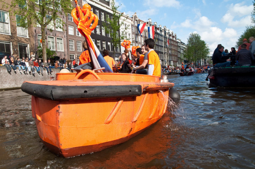 orange boat in amsterdam