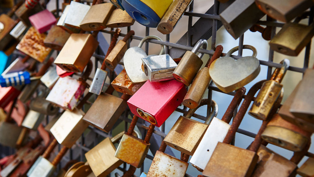 Coloured Padlocks on a bridge
