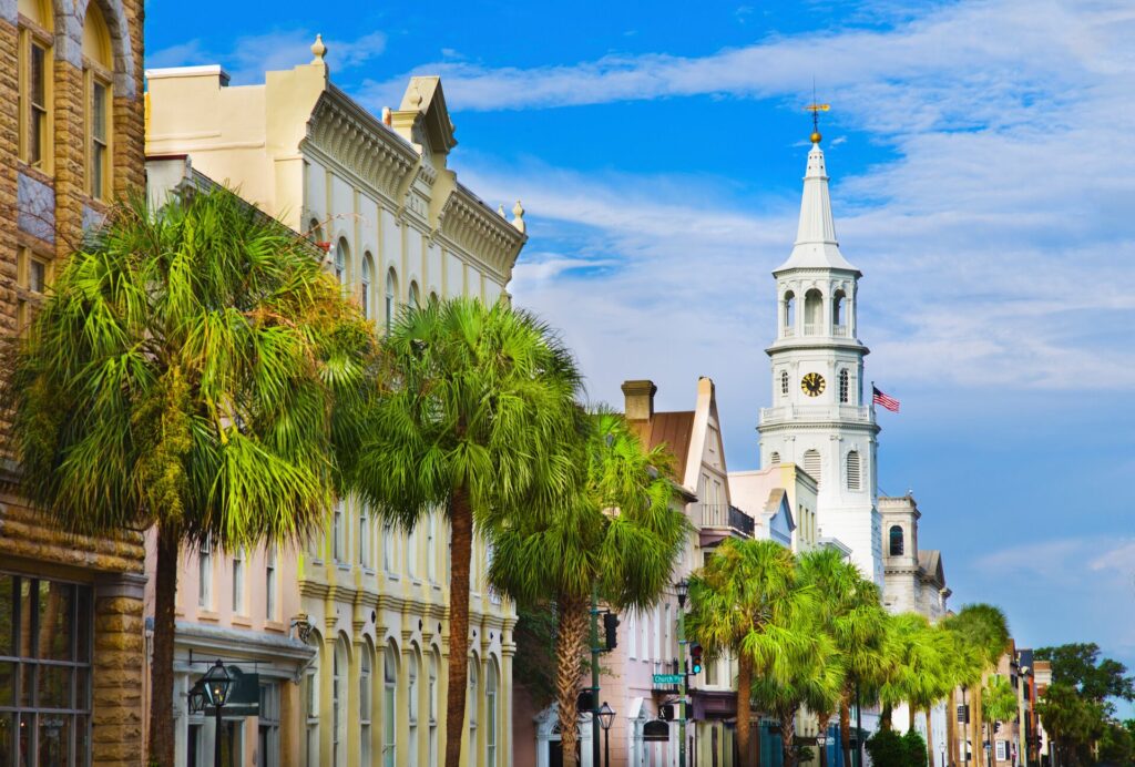 Charleston street with American flag waving from tower