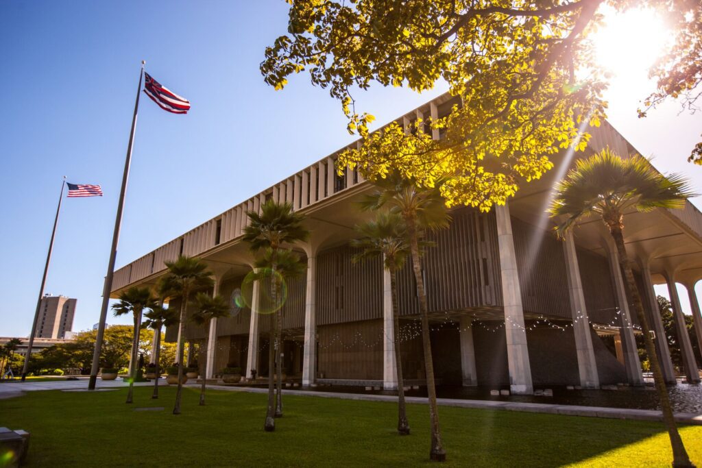 Honolulu state capitol with flags flying high