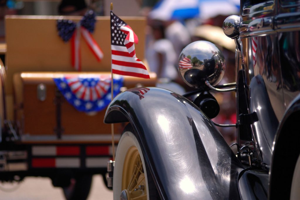 Close-up of flag on classic car during Memorial Day in the US