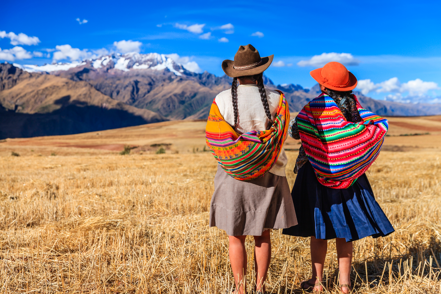 South American destinations Peru-www.istockphoto.comgbphotoperuvian-women-in-national-clothing-crossing-field-the-sacred-valley-gm187572264-28790568-Hadynyah