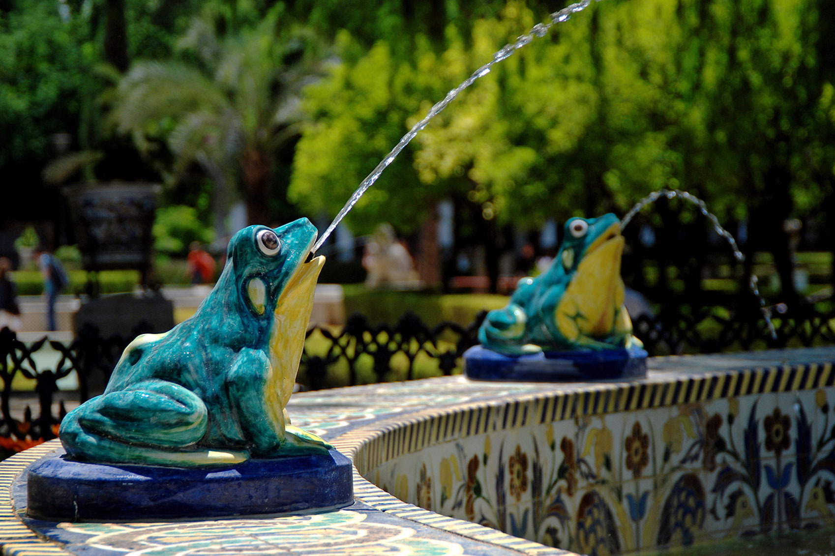 Colourful ceramic frogs at Parque María Luisa in Seville, Spain.