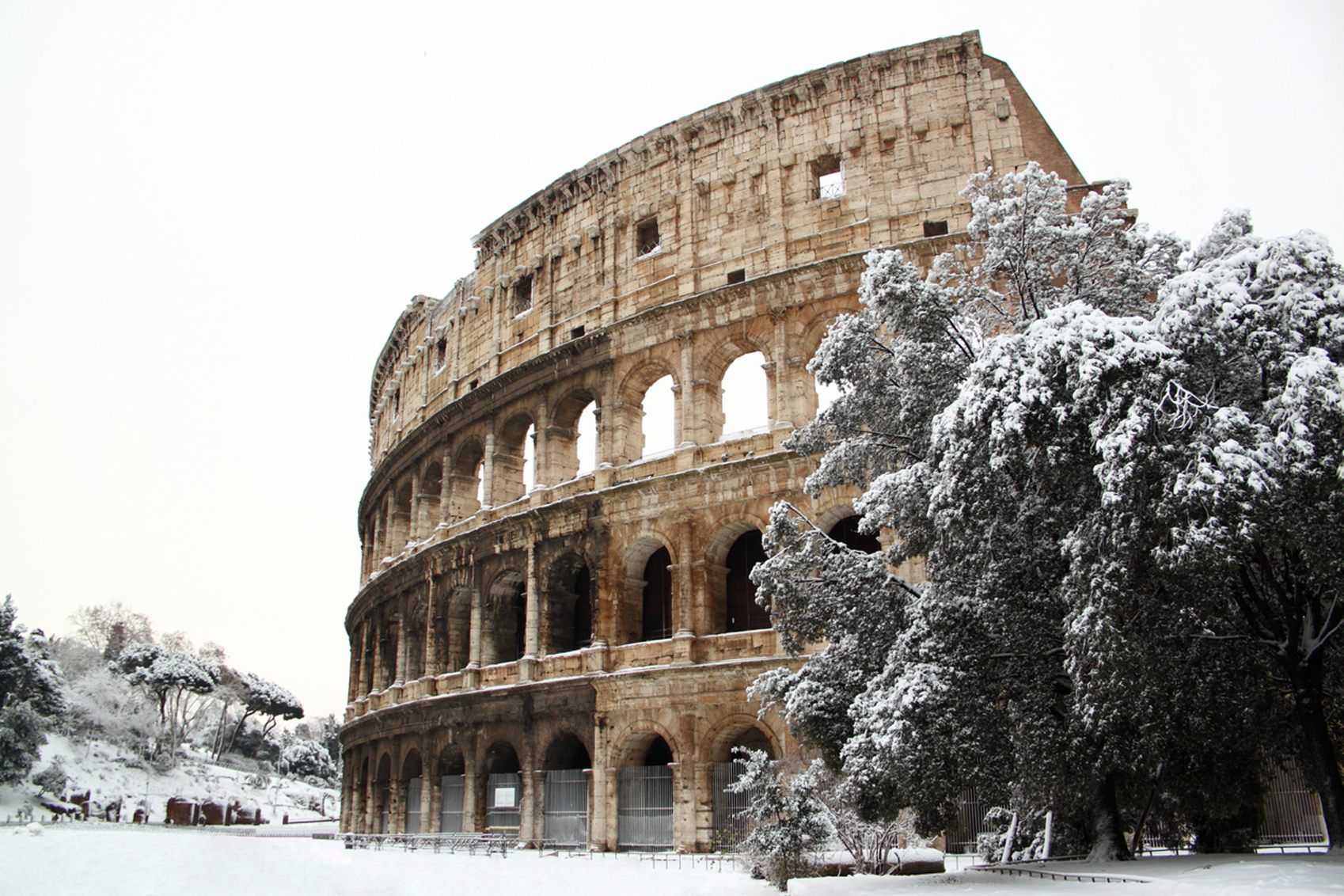 Visit Europe in Winter Coliseum-winterwww.istockphoto.comgbphotothe-coliseum-covered-by-snow-gm139948622-19351645-MattiaATH