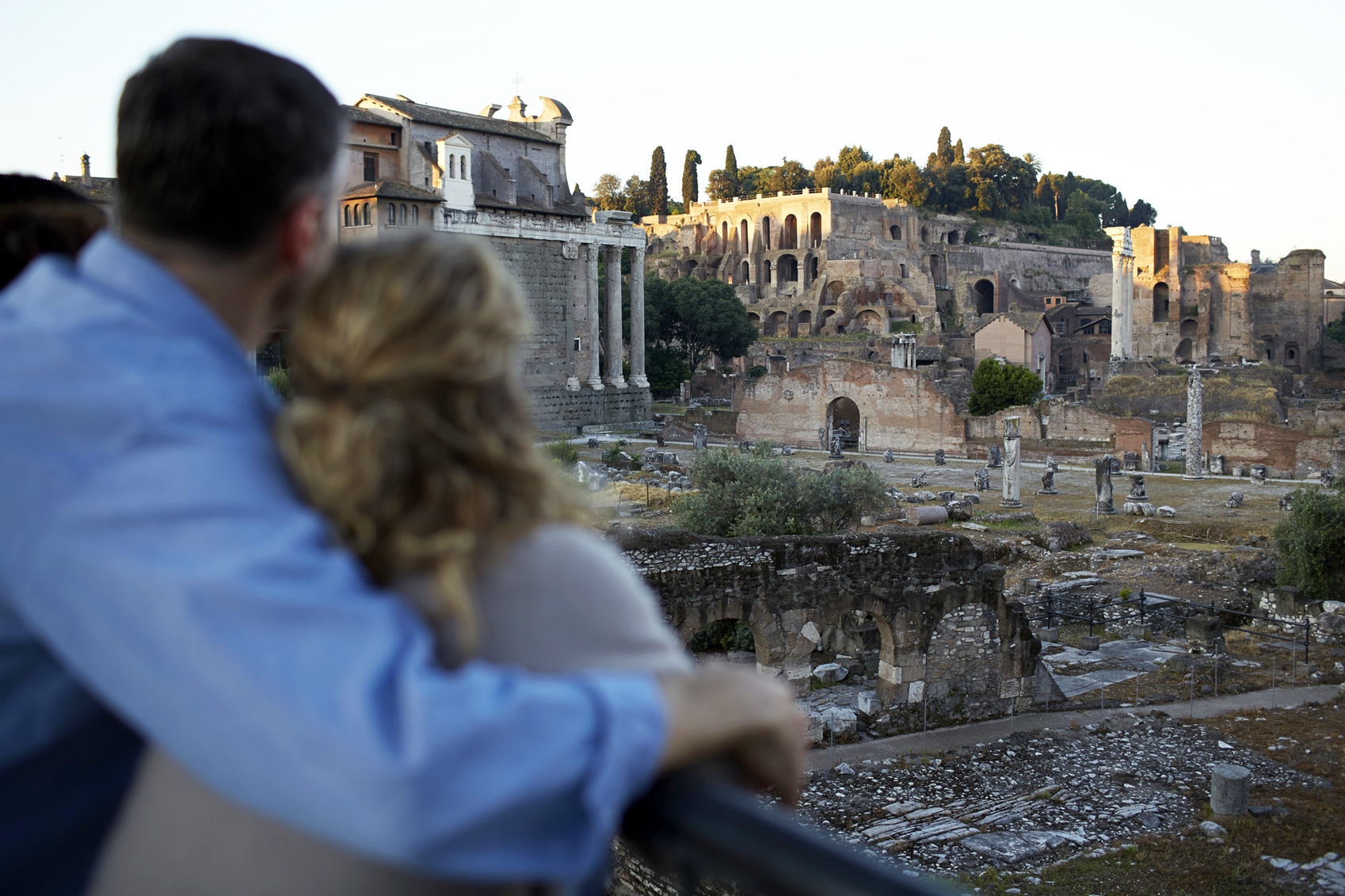 couple looking over Roman ruins Rome