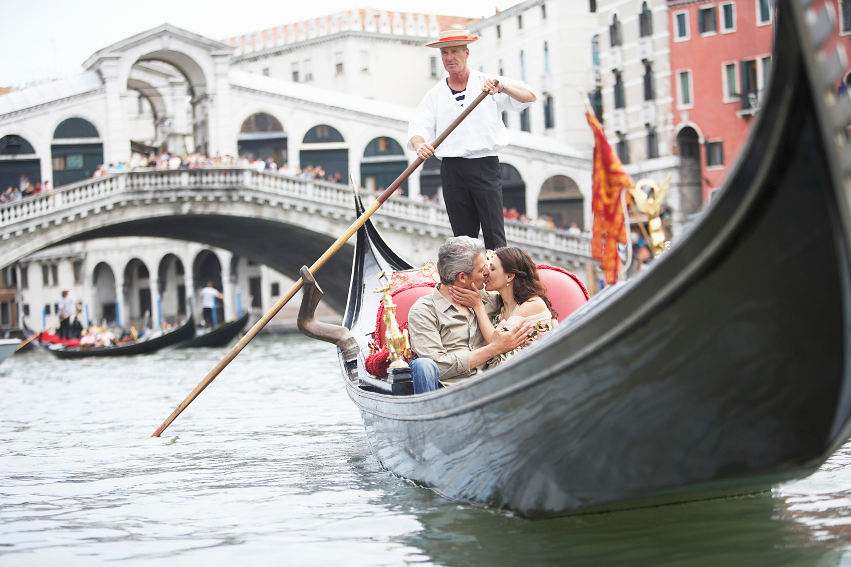 couple kissing on a gondola in venice