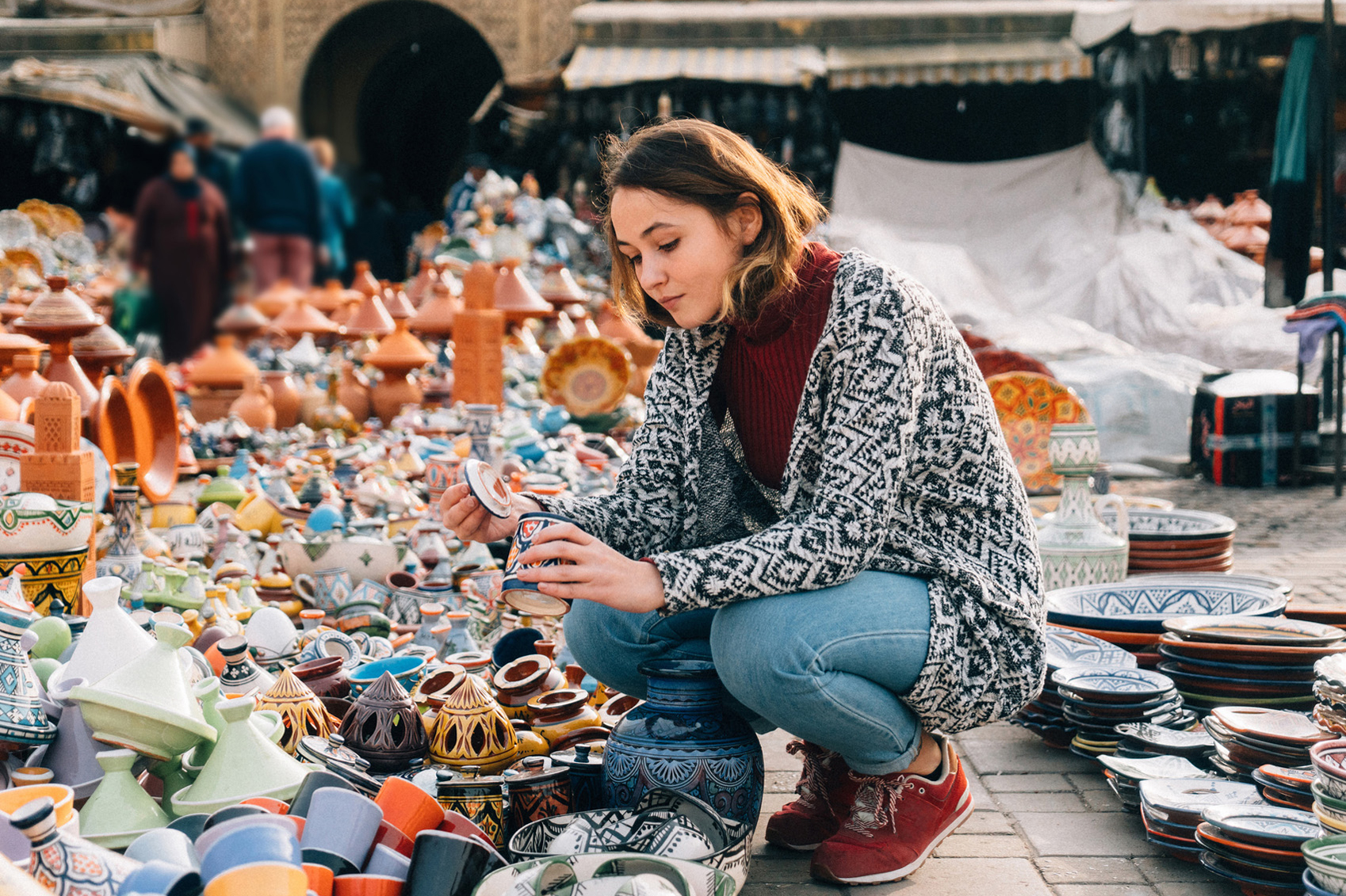 real Morocco Woman-Choosing-Ceramic-www.istockphoto.com_gb_photo_woman-choosing-ceramic-in-shop-in-meknes-morocco-gm668770734-122450177-Oleh_Slobodeniuk