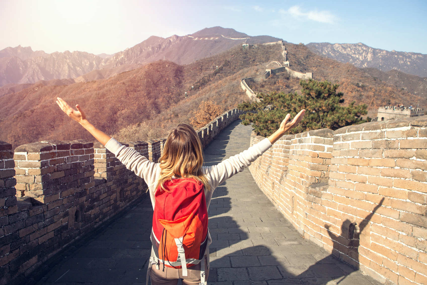 Reasons to visit China Woman-at-Great-Wall-of-China-www.istockphoto.com_gb_photo_young-woman-embracing-nature-great-wall-of-china-gm638807176-114768029-swissmediavision