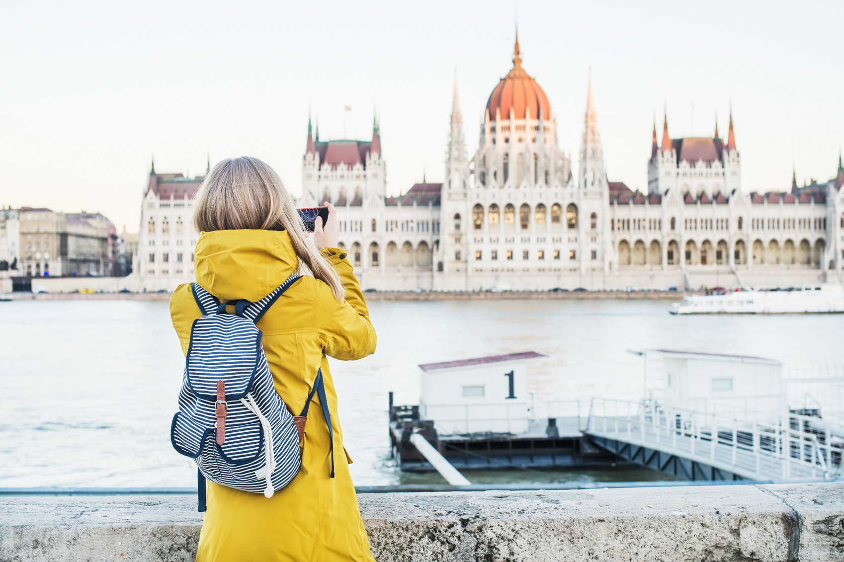 Best Value European Cities Tourist-Parliment-Building-www.istockphoto.com_gb_photo_young-blondy-woman-tourist-making-photos-of-parliament-historic-building-gm532271974-94191763-Foxys_forest_manufacture