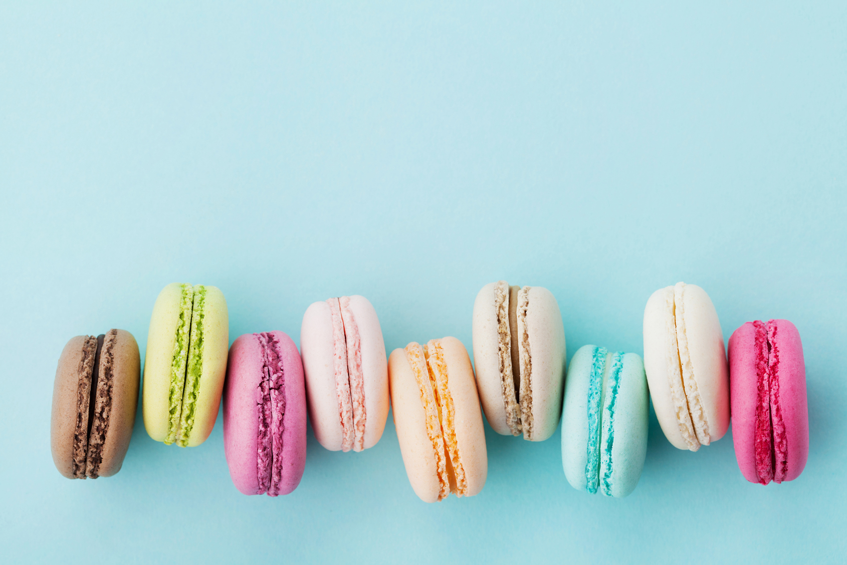 Colourful foods pastel-cake-macaroon-www.istockphoto.com_gb_photo_cake-macaron-or-macaroon-on-turquoise-background-pastel-colors-gm530928090-93568707-Julia_Sudnitskaya