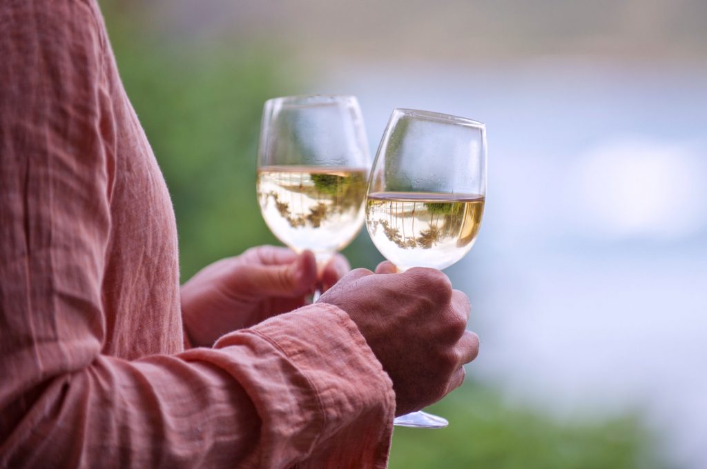 Two glasses of white wine at a Hawaiian wine tasting