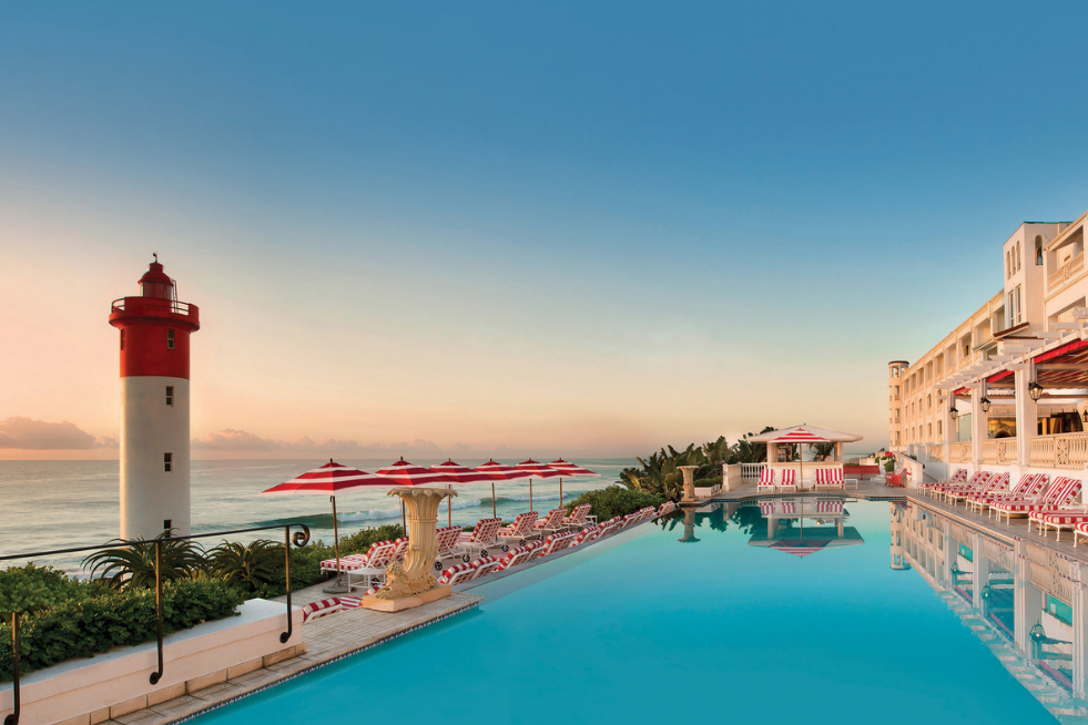 Oyster Box Hotel's pool and uMhlanga Rocks Lighthouse, South Africa