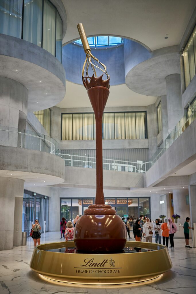 A giant melting chocolate on a whisk sculpture