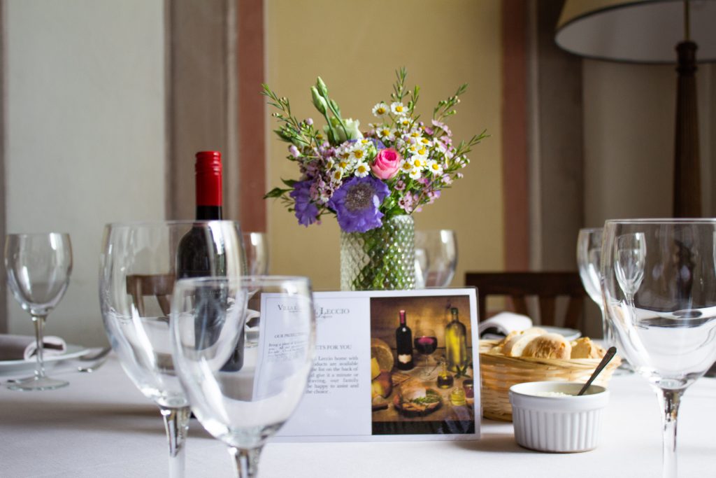 Guests enjoy a multi-course Tuscan feast as part of their culinary tour in Tuscany.