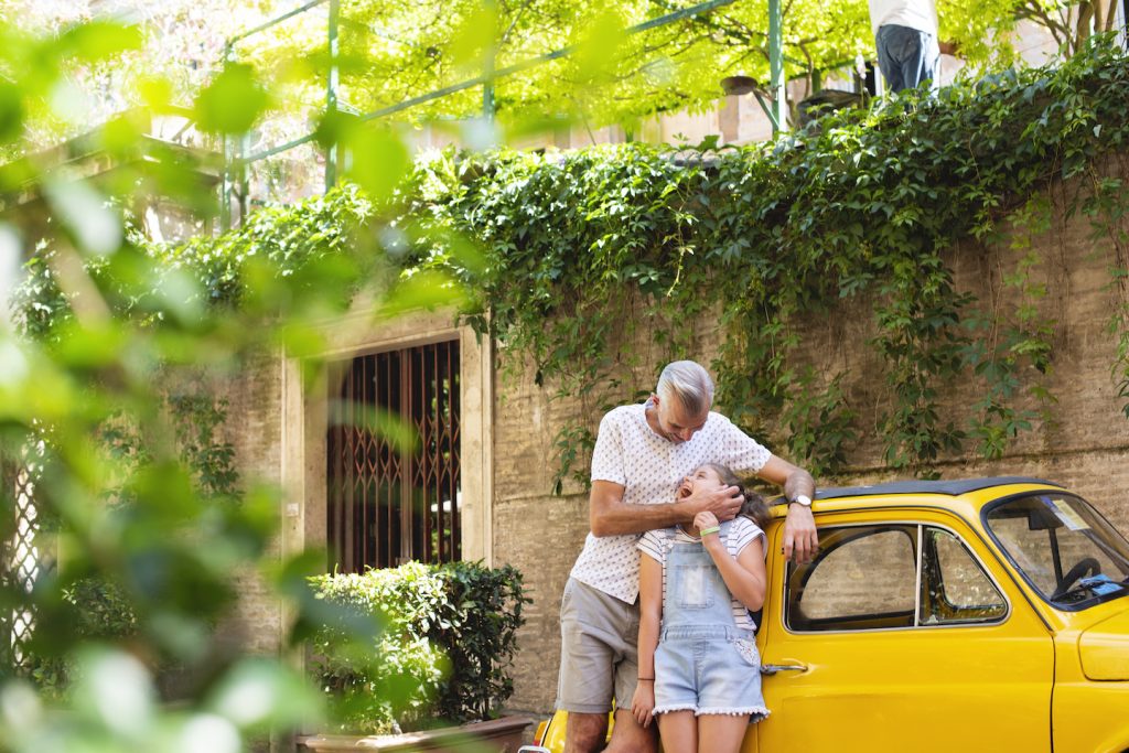 father and daughter playing together in rome