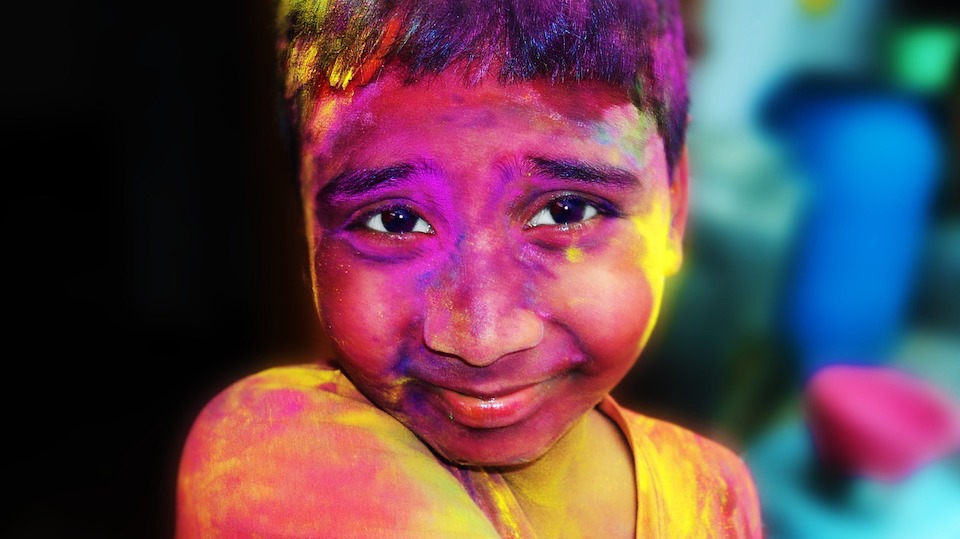 young boy at holi festival, india