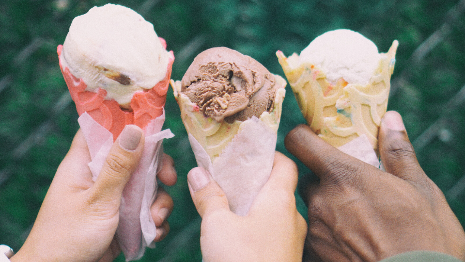 People holding ice cream cones