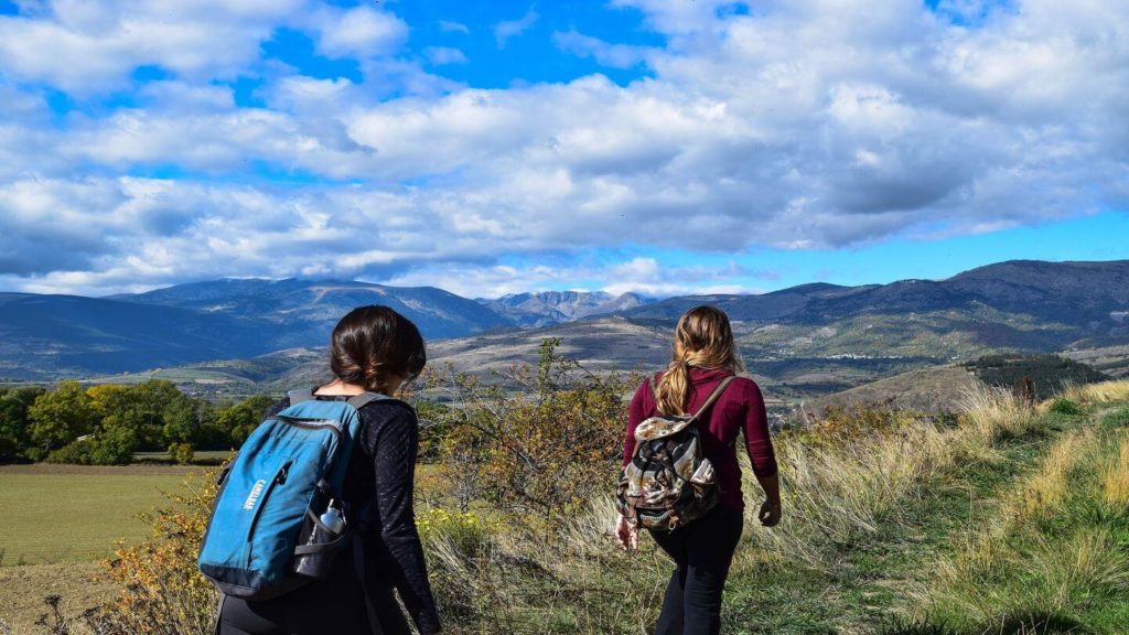 two women hiking in countryside