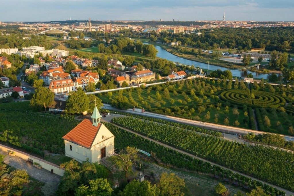 Greenery and botanical gardens in Prague, gardens in the forefront and river in the background.