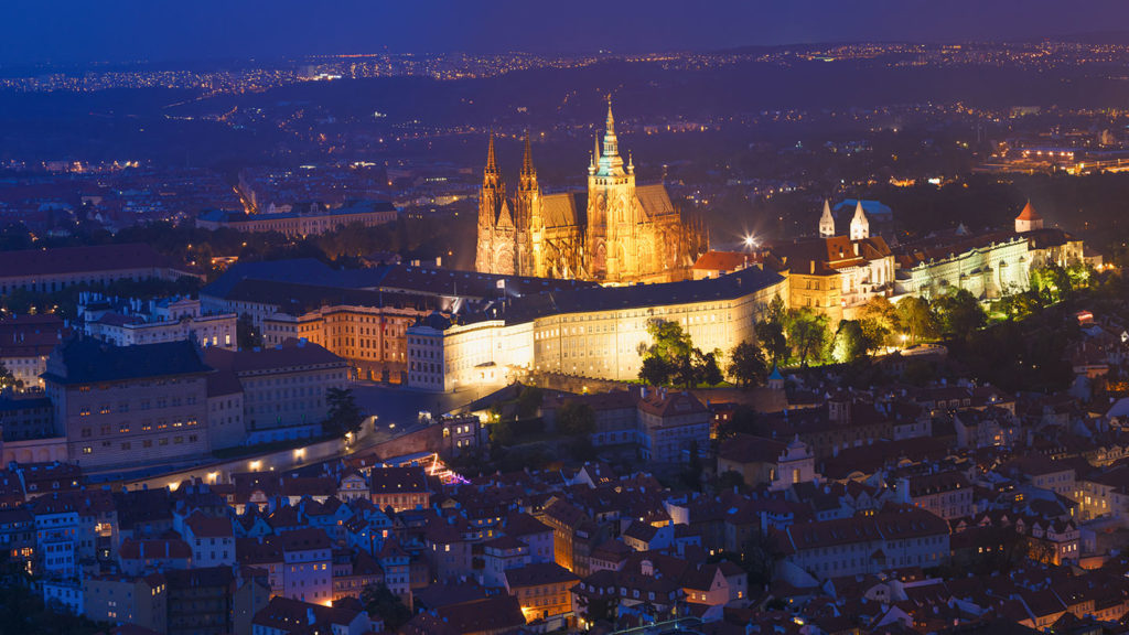 Aerial view by night of a castle in Prague - interesting Prague facts