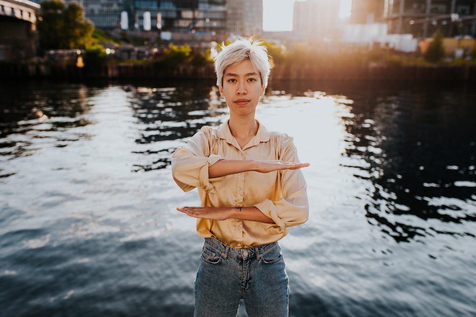 Women doing Each for Equal sign