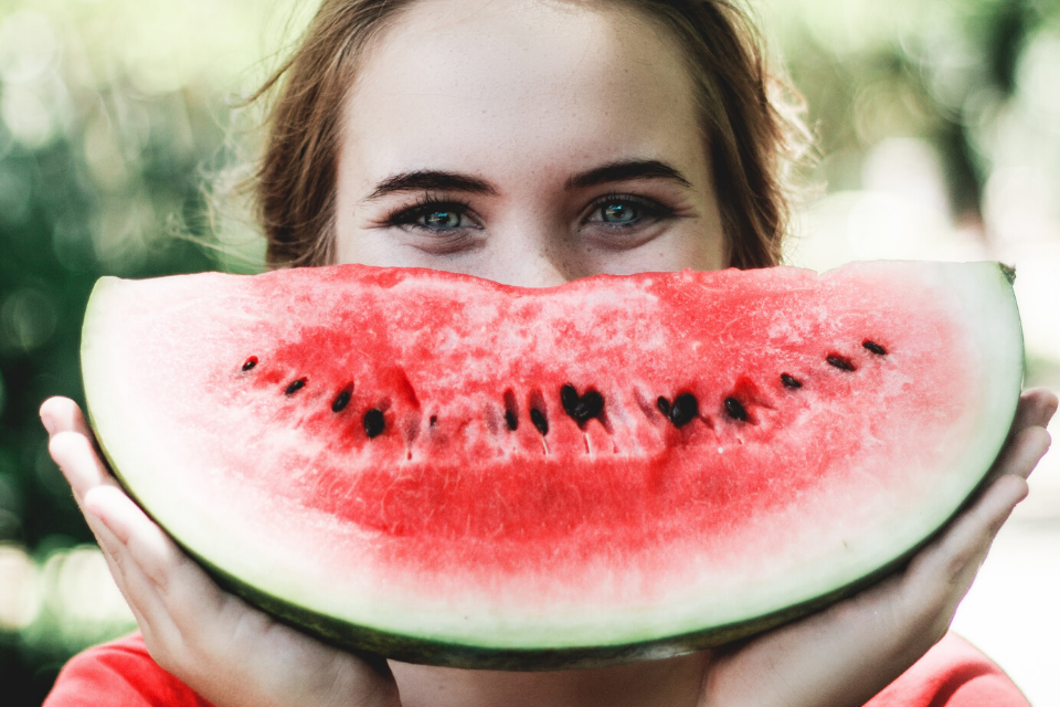 woman smiling with watermelon