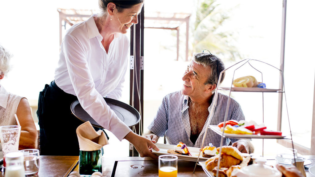 Waitress serving food
