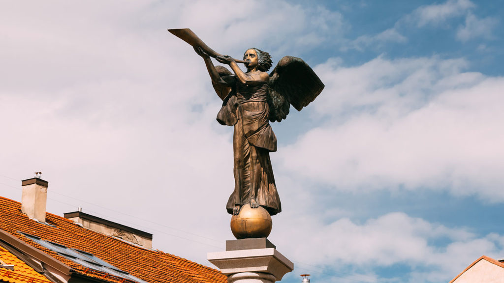 Statue of an angel blowing a horn