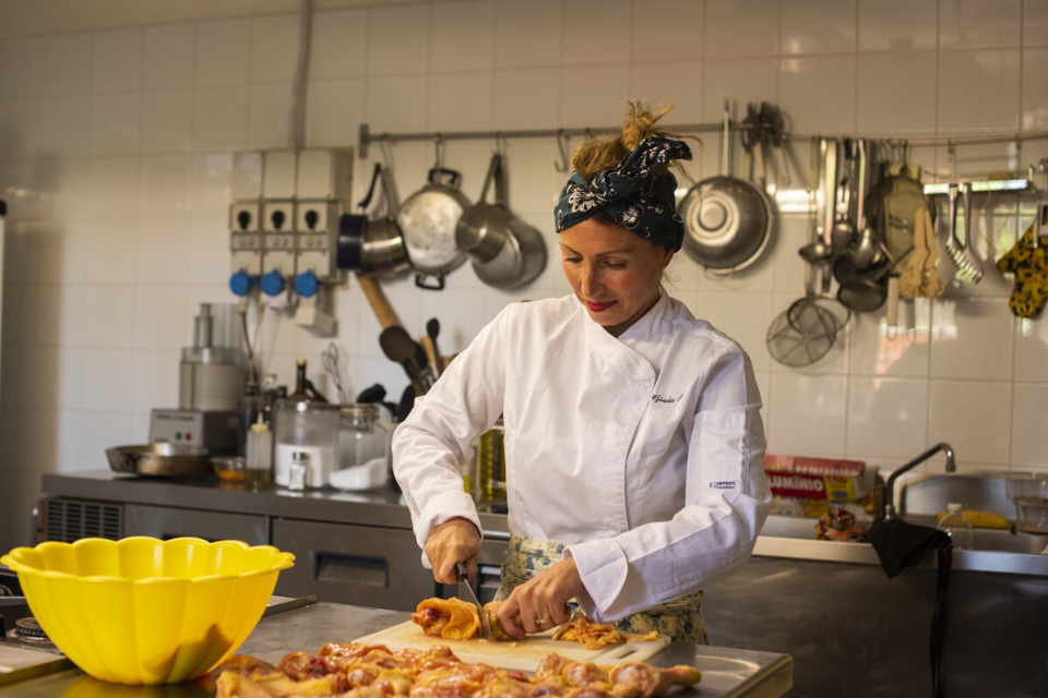 Giada Landi cooking food in her kitchen