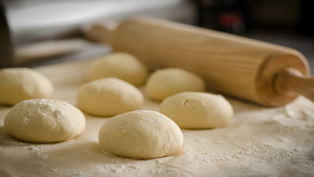 rolling dough baking travel themed activities