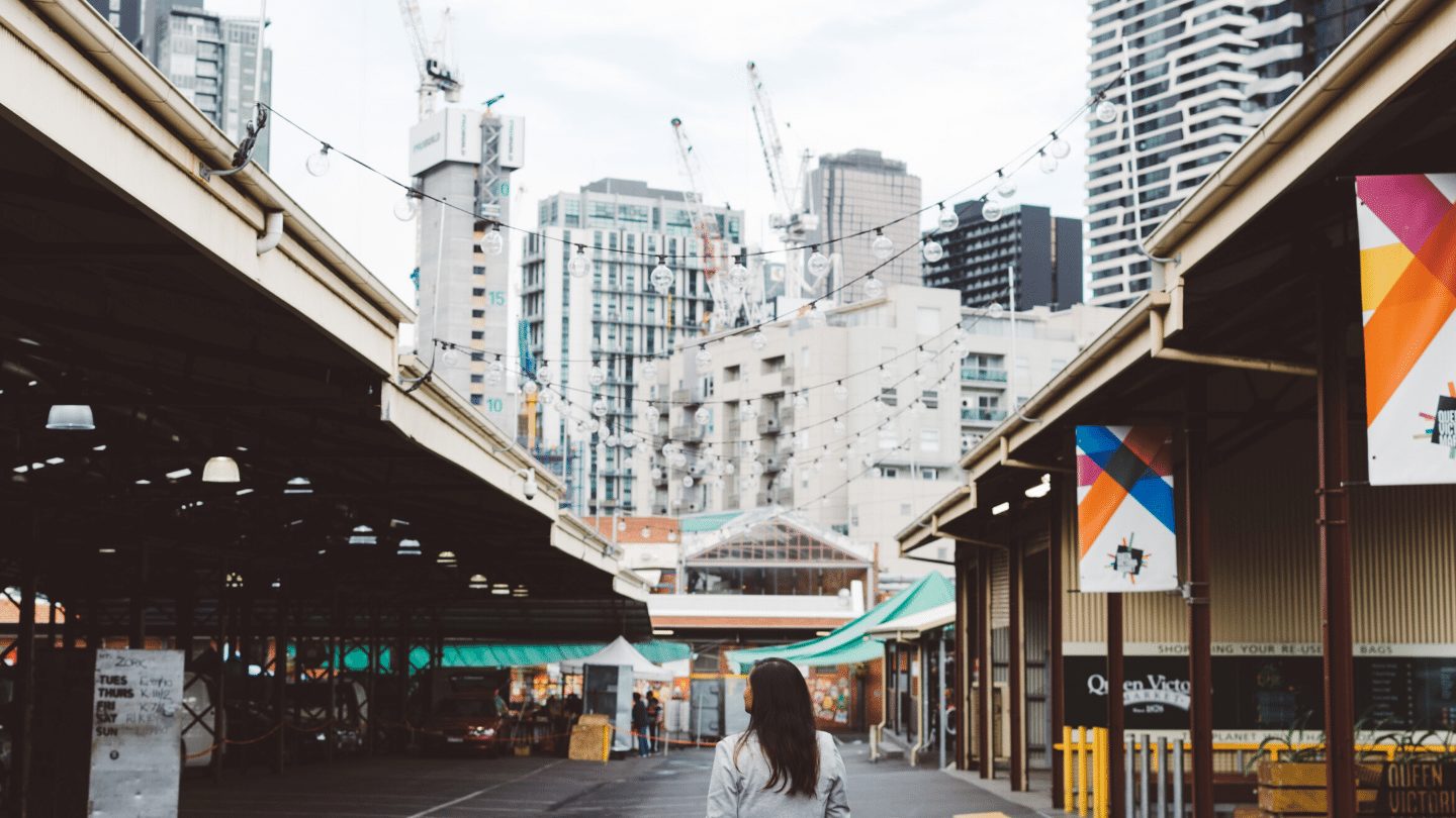 A woman standing in Queen Vic market Melbourne
