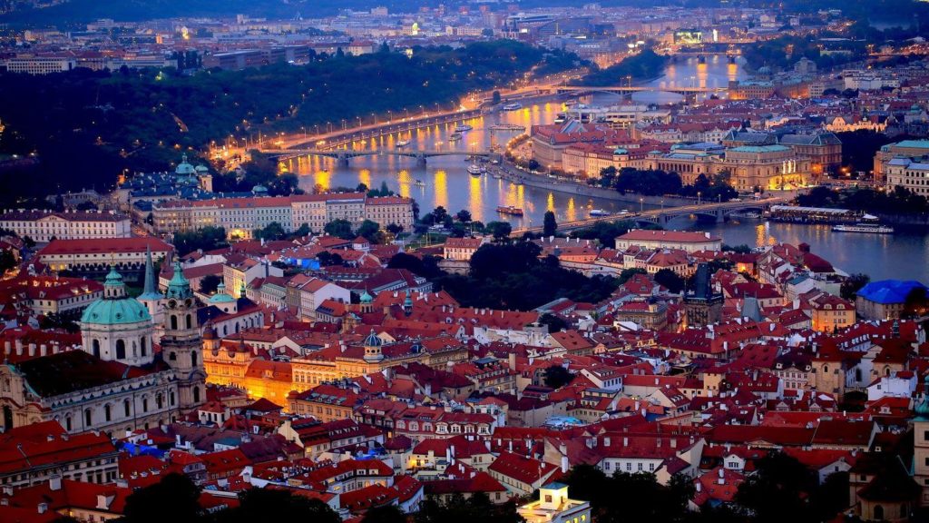 aerial view over prague illuminated night