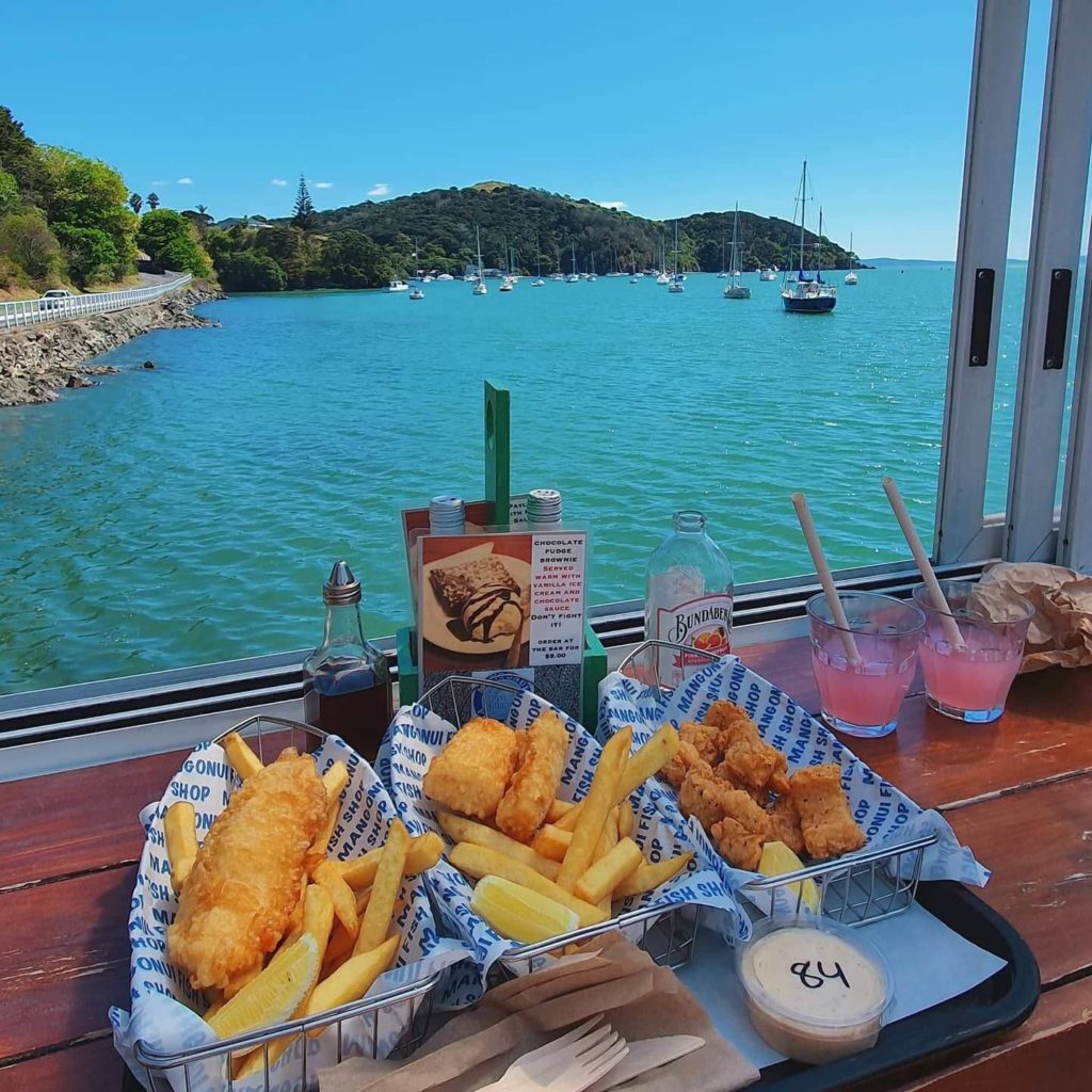 fish and chips overlooking blue water Mangonui town New Zealand
