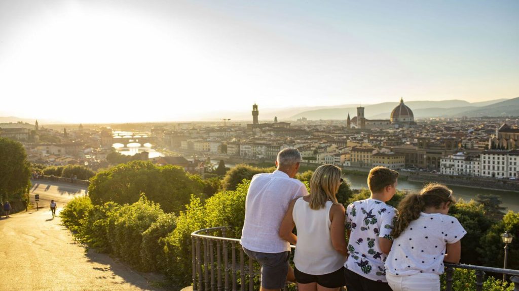 family looking out over viewpoint family travel