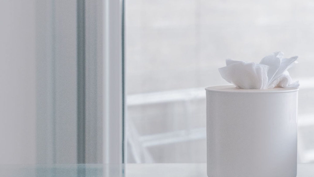 box of tissues next to a window