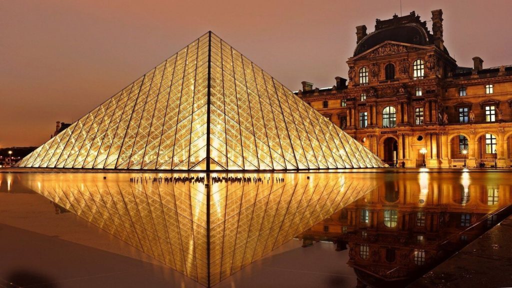 The Louvre pyramid illuminated at night