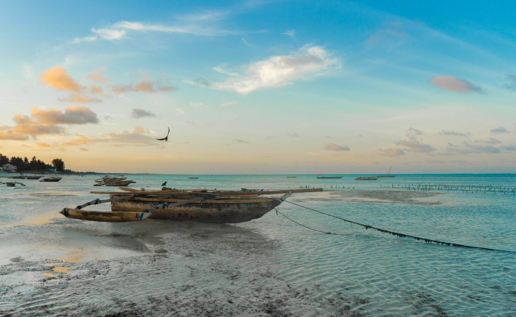 A fishing boat on shore of a stunning beach in Zanzibar