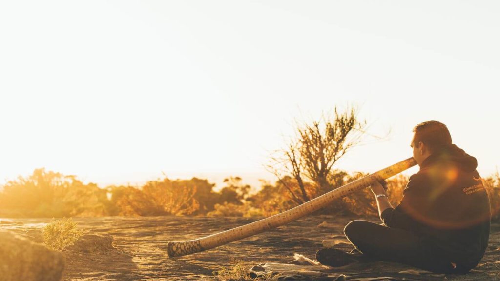 Indigenous man playing the didgeridoo Australia