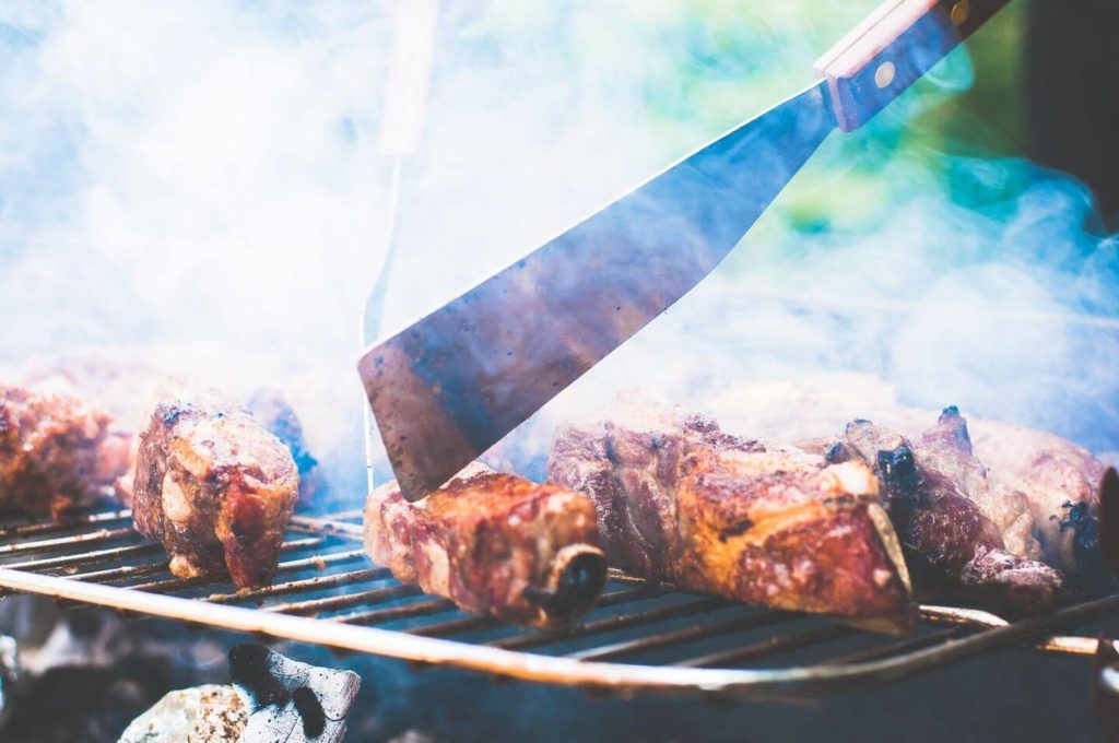 meat on a smoky grill South African braai