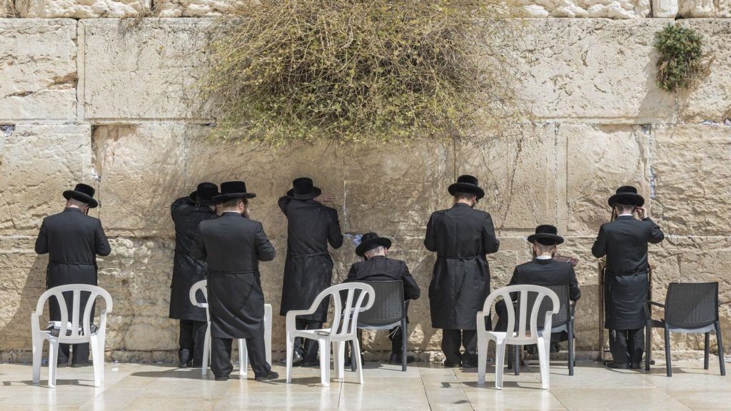 worshippers praying at the western wall in Jerusalem Israel