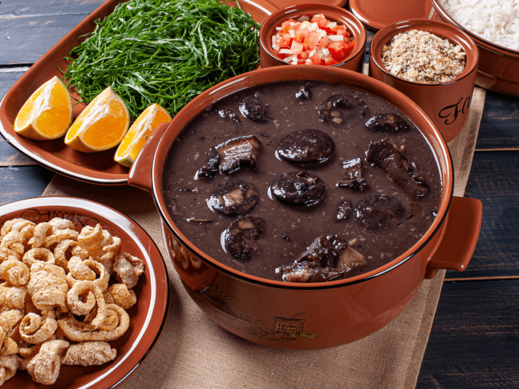 Platter of Feijoada and other side dishes