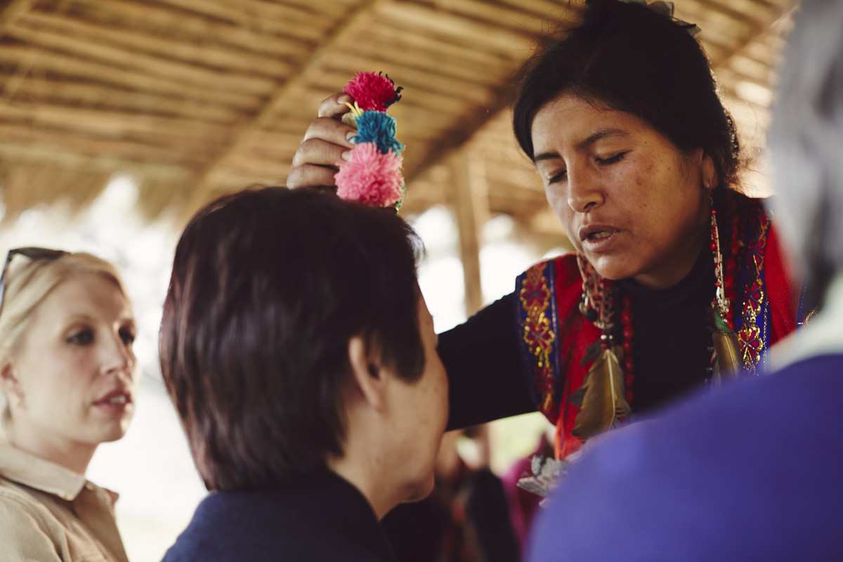 A local Peruvian woman blessing a guest