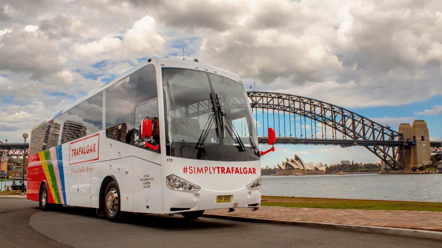 Trafalgar coach in front of Sydney Harbour Bridge