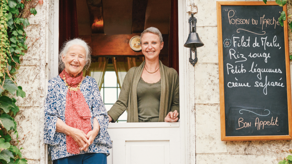 Beatrice Be My Guest host smiling from doorway